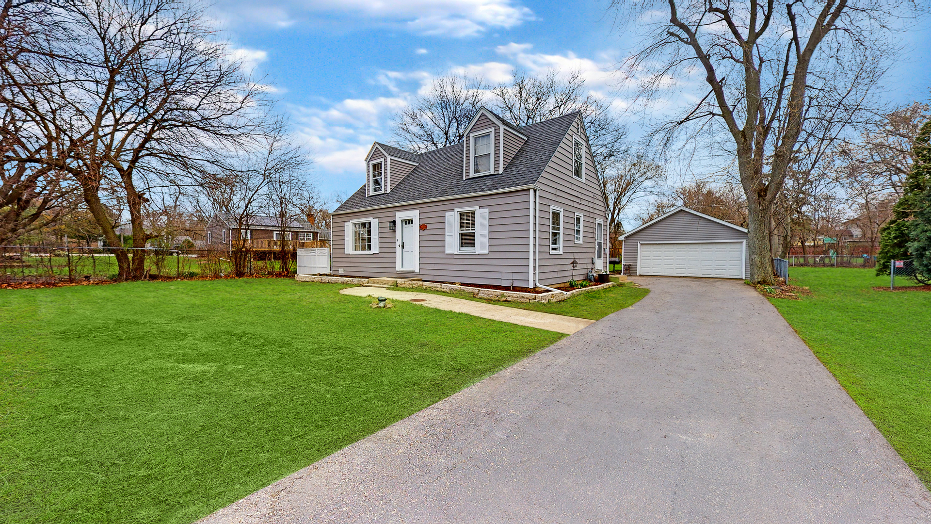 26W529 Geneva Road Wheaton, IL 60187 - Photo 2 of 15 a front view of house with yard and green space