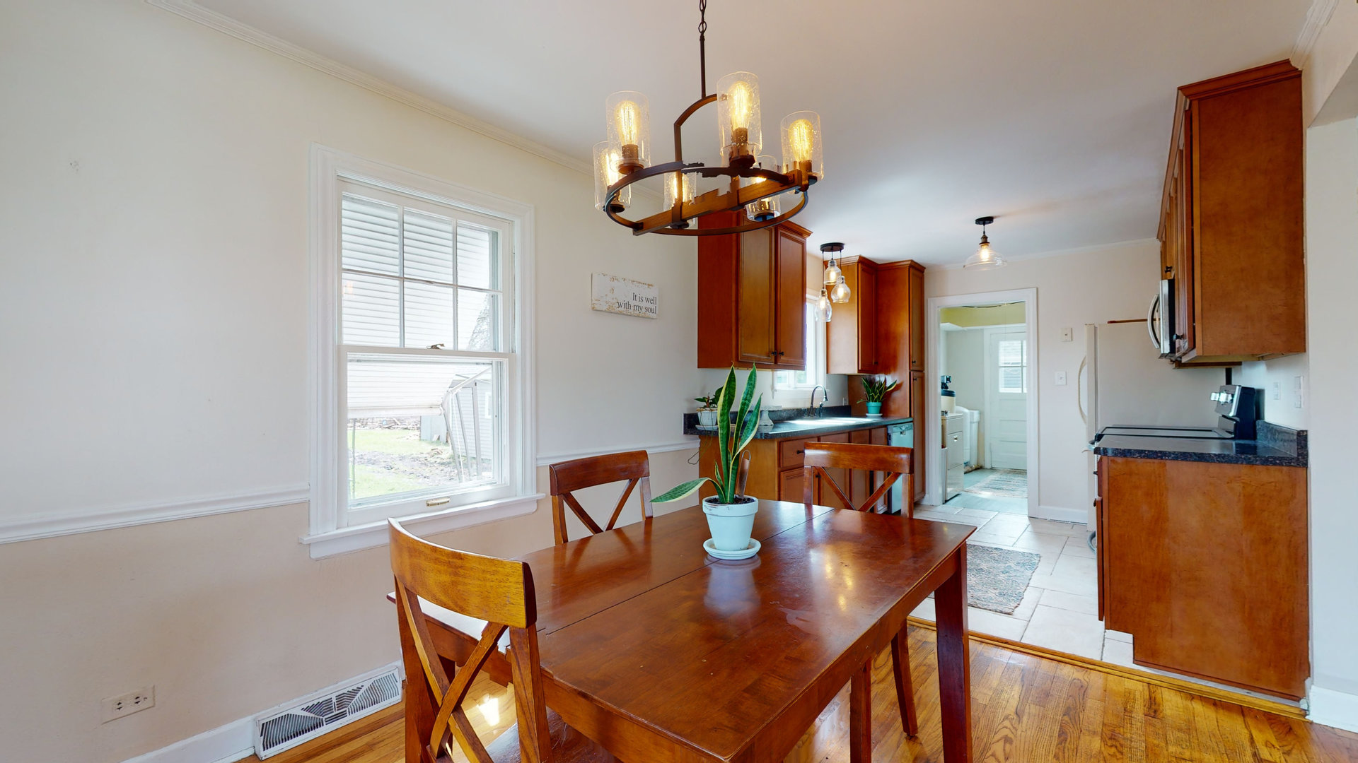 26W529 Geneva Road Wheaton, IL 60187 - Photo 7 of 15 a view of a dining room with furniture window and wooden floor