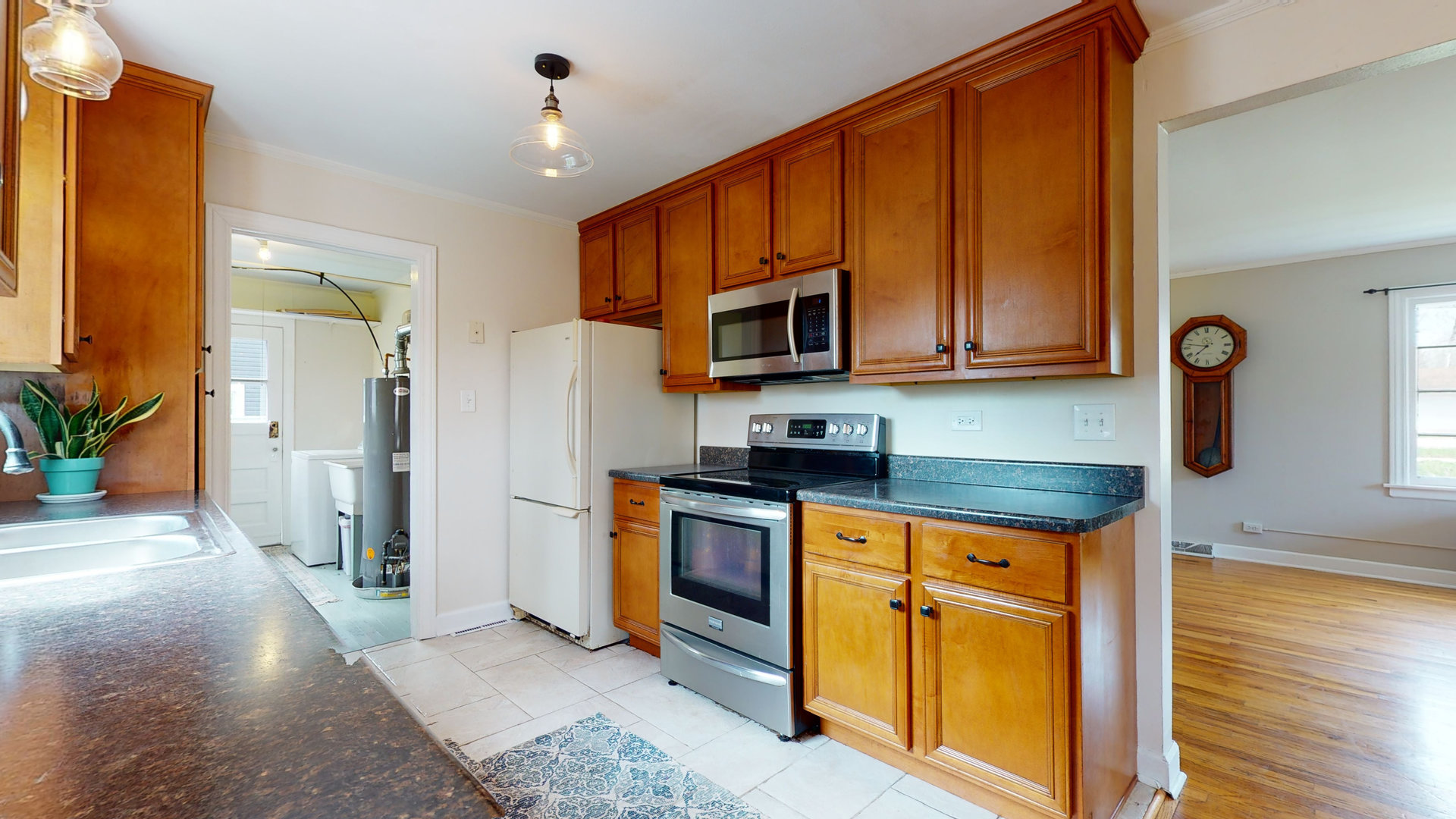 26W529 Geneva Road Wheaton, IL 60187 - Photo 9 of 15 a kitchen with stainless steel appliances granite countertop wooden cabinets a sink and a stove