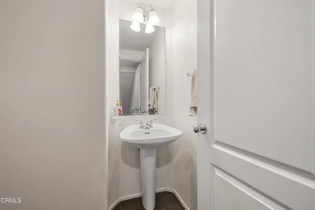 a bathroom with a sink a mirror and vanity