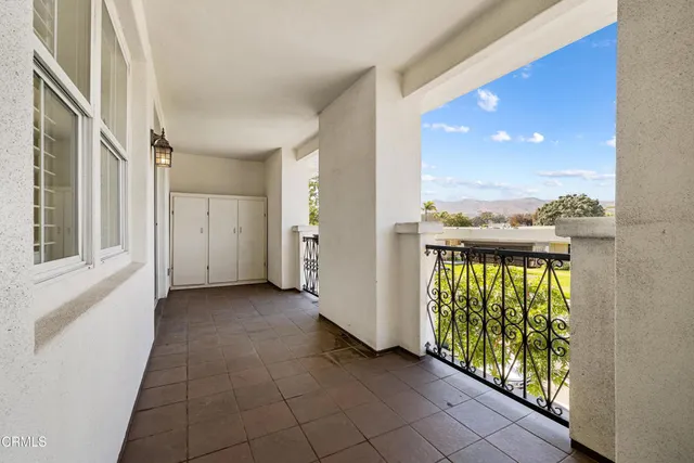 a kitchen with a sink a stove a refrigerator a center island and a window