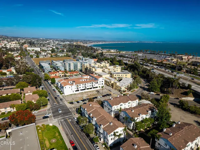 an aerial view of residential houses with outdoor space