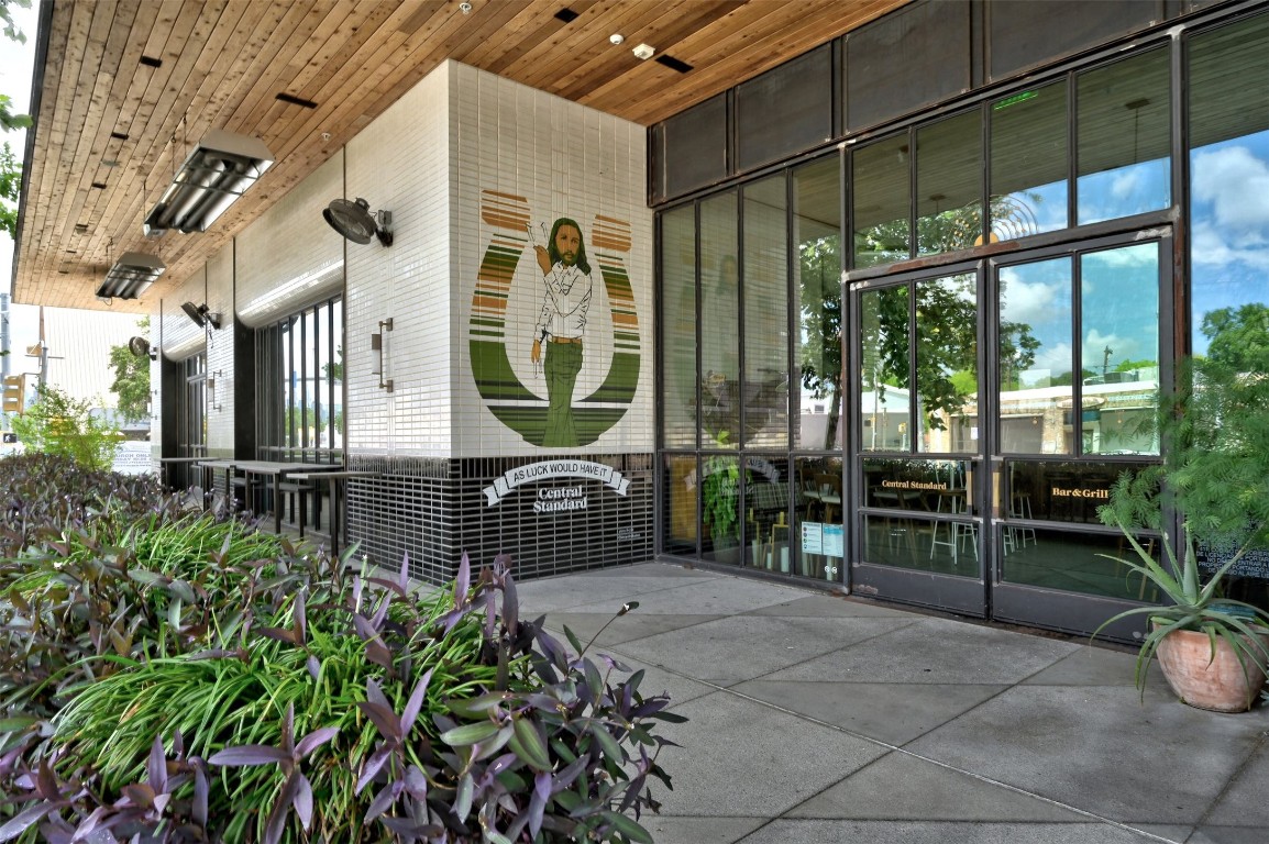 4518 South 2nd Street Austin, TX 78745 - Photo 25 of 37 a porch with a bench and potted plants
