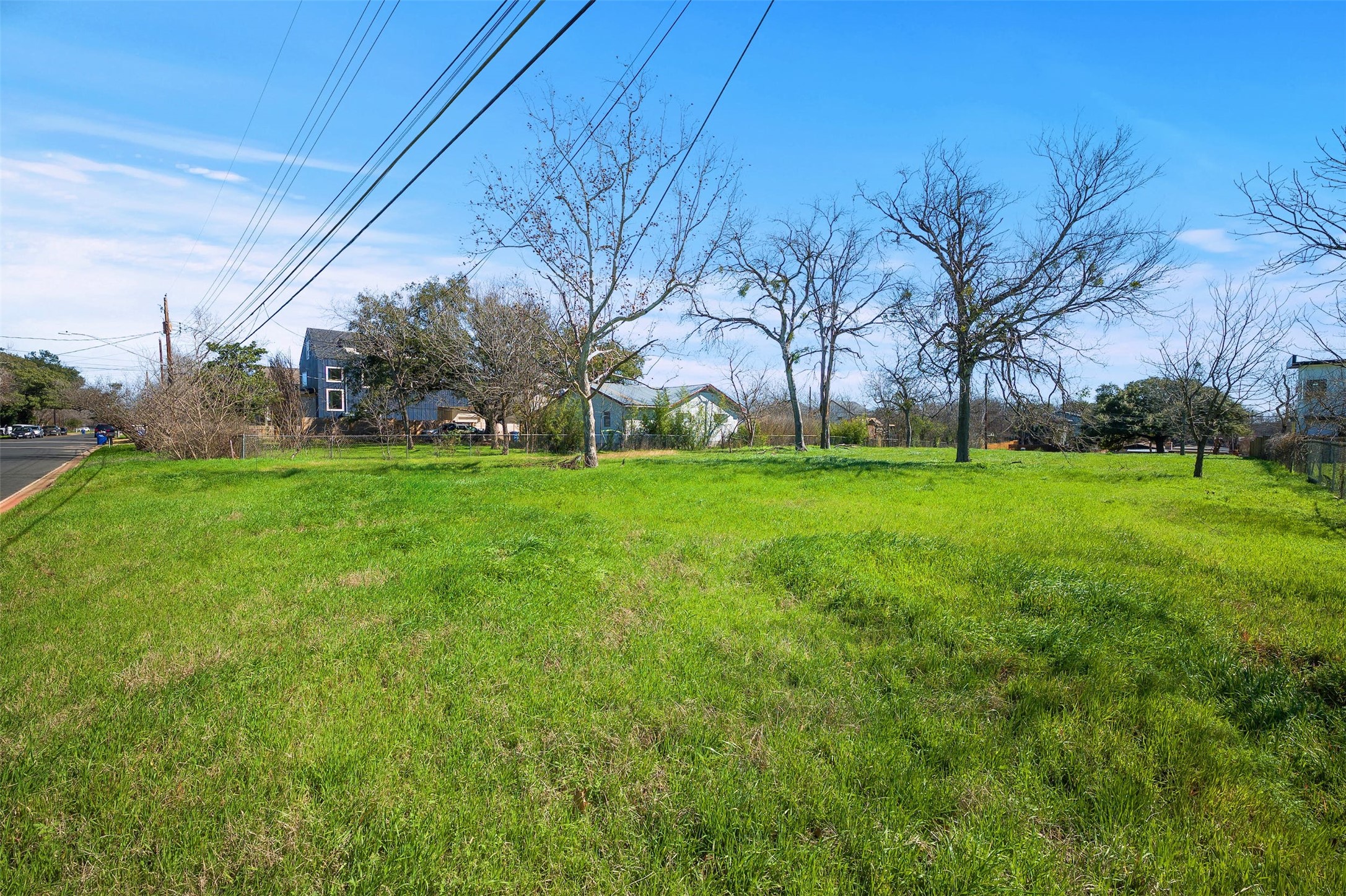 4518 South 2nd Street Austin, TX 78745 - Photo 6 of 37 a view of a grassy field with trees