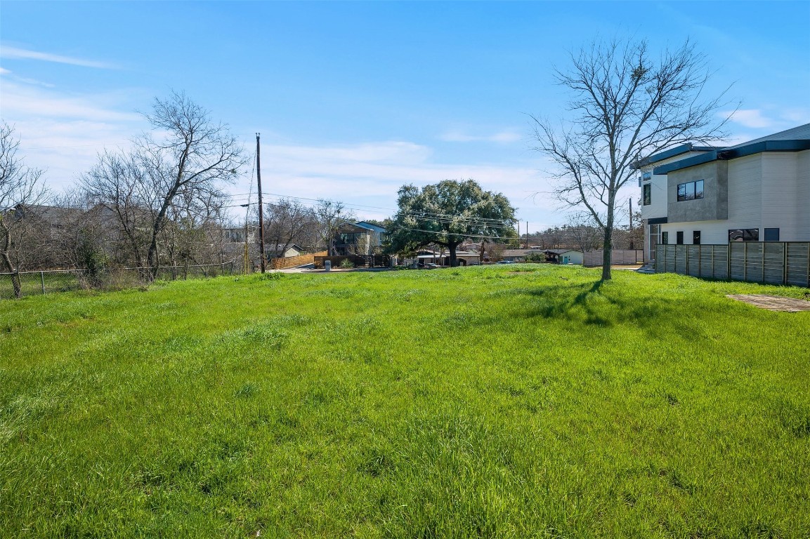 4518 South 2nd Street Austin, TX 78745 - Photo 7 of 37 a backyard of a house with lots of green space and fountain