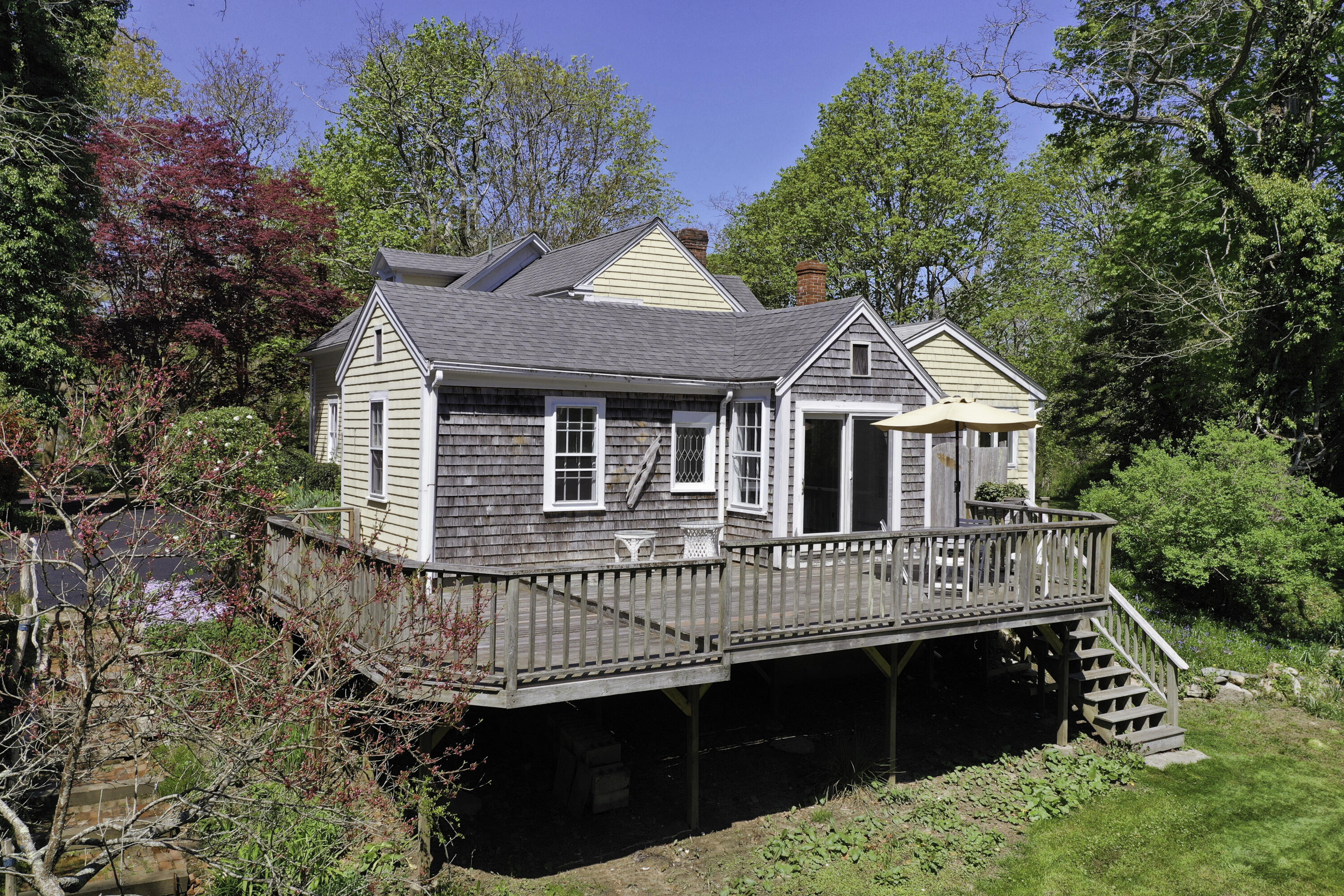 1295 County Road Cataumet, MA 02534 - Photo 2 of 16 a front view of a house with a balcony