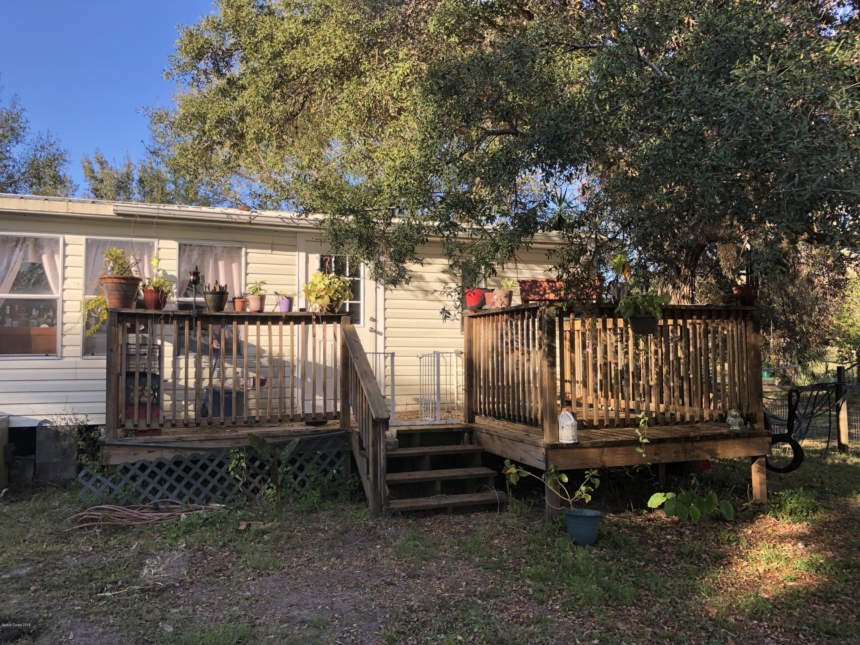 4795 Harrison Road Mims, FL 32754 - Photo 16 of 19 Back Wooden Deck