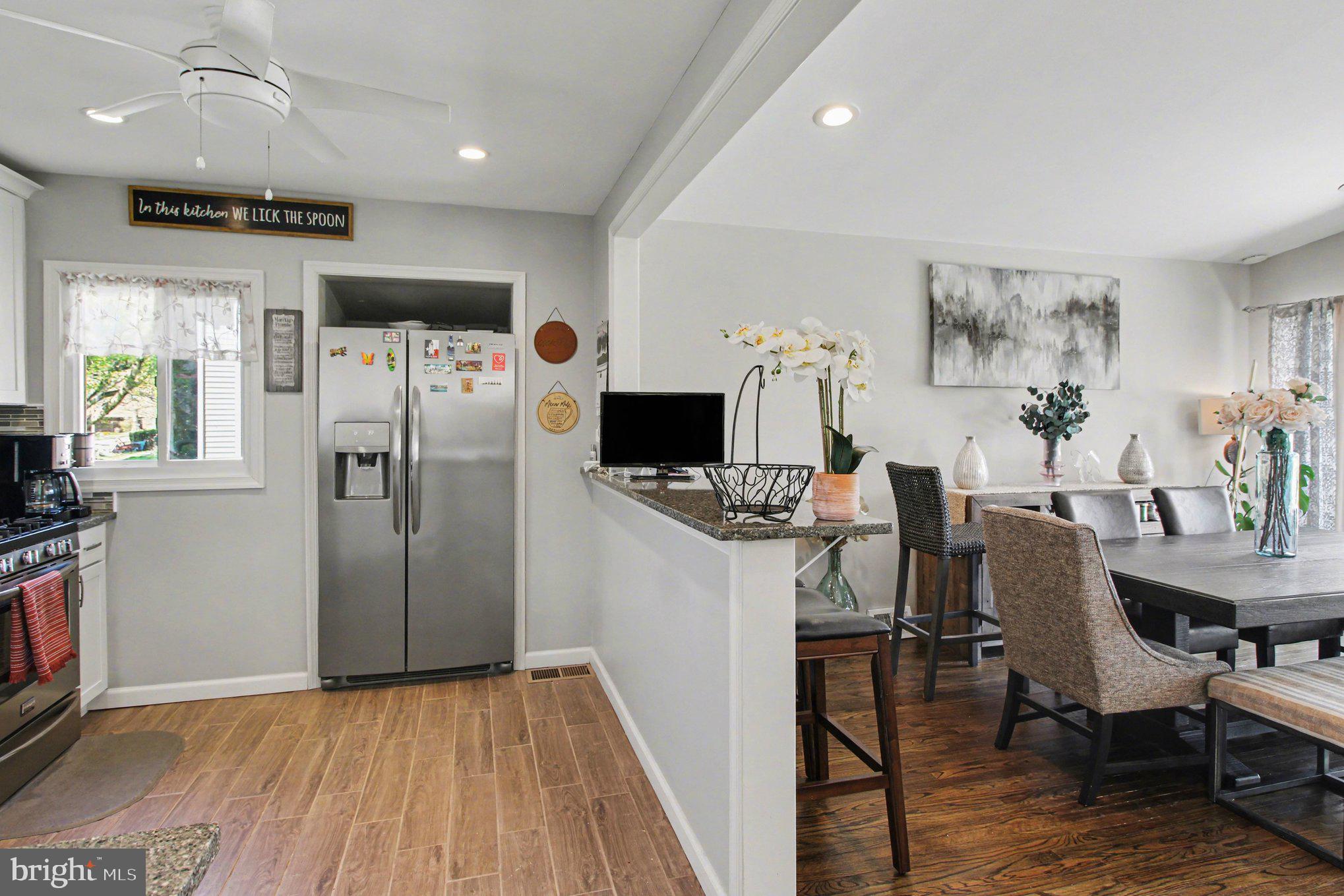 908 Fraser Road Glenside, PA 19038 - Photo 15 of 36 a view of a dining room with furniture window and wooden floor
