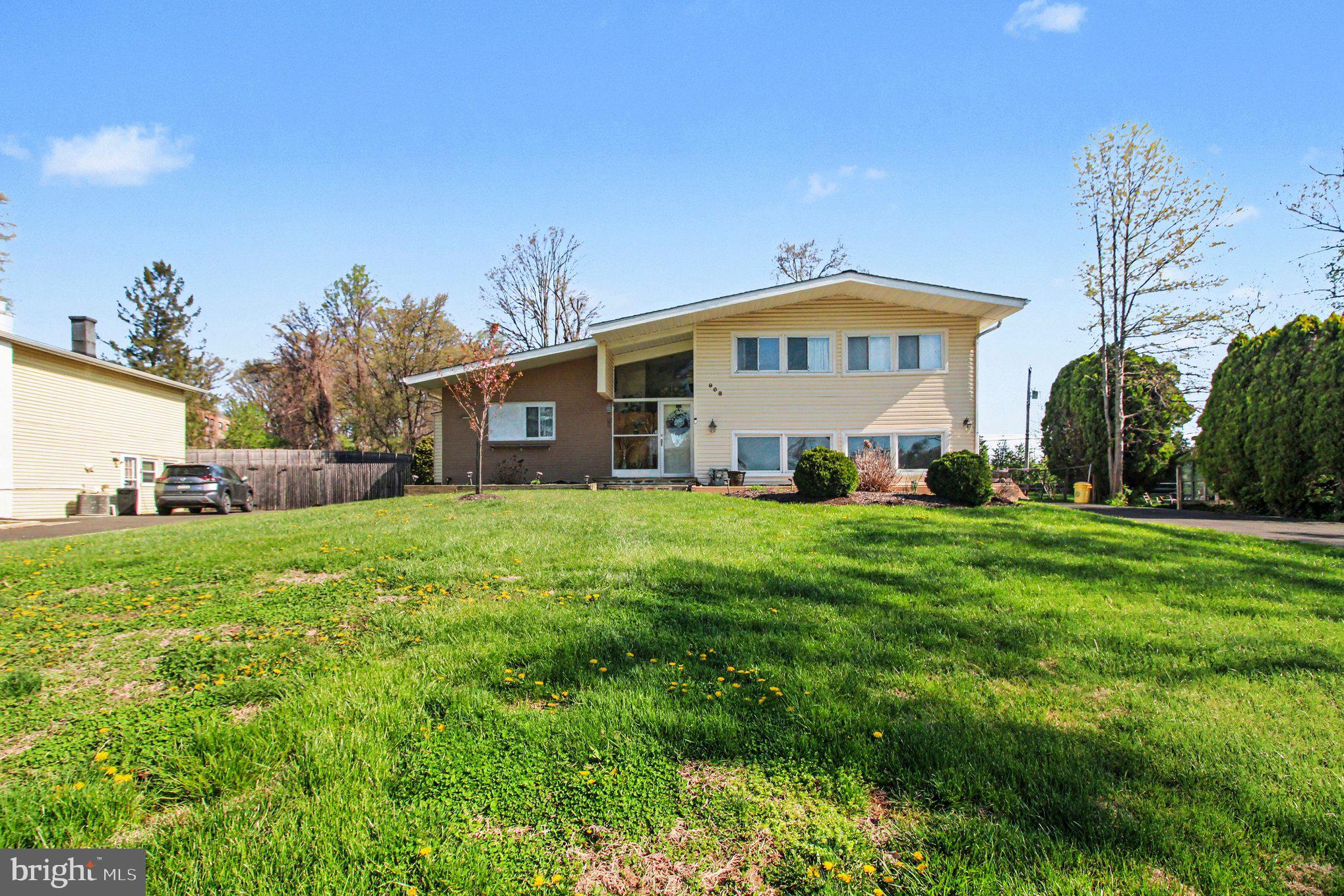 908 Fraser Road Glenside, PA 19038 - Photo 2 of 36 a front view of a house with a yard table and chairs