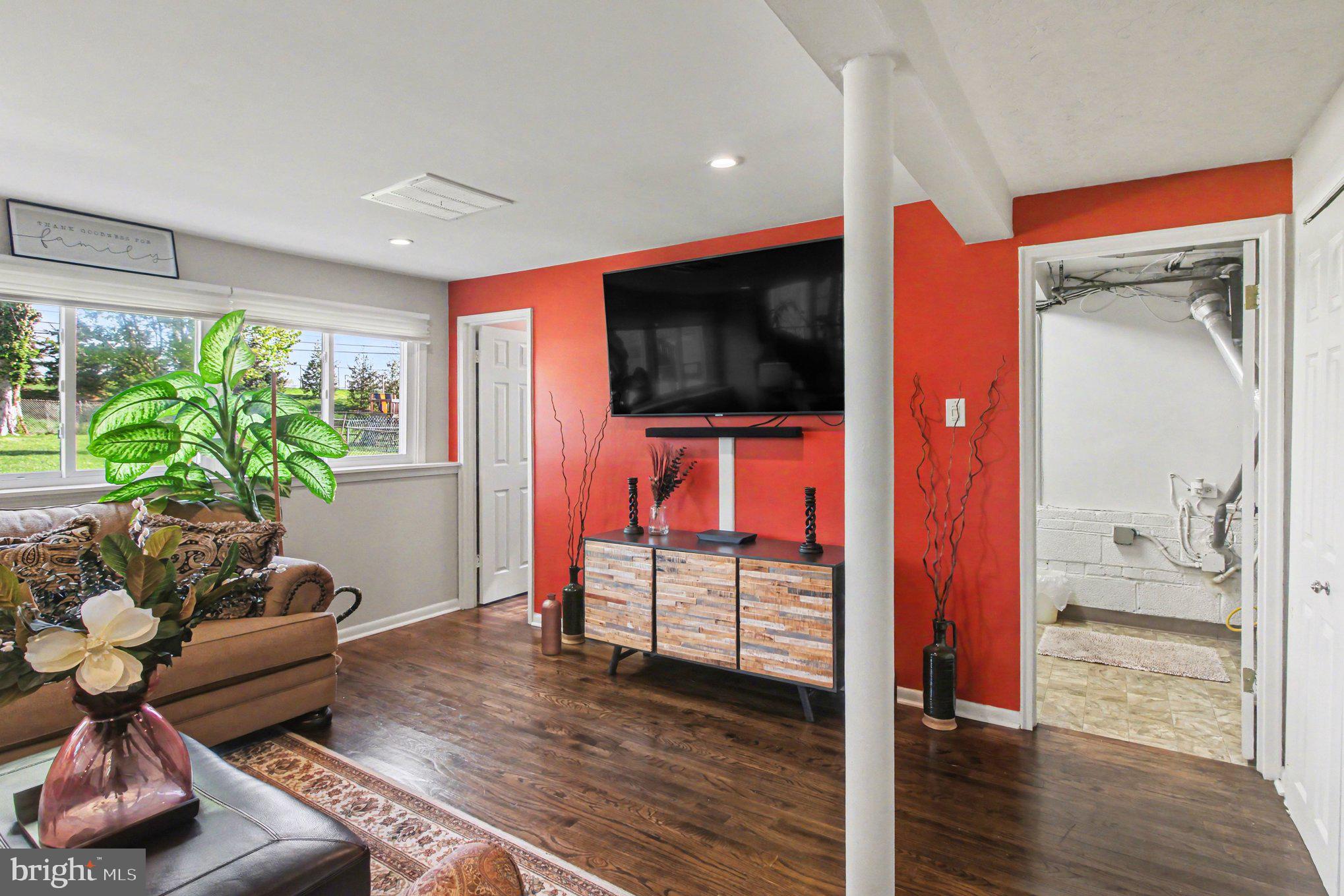 908 Fraser Road Glenside, PA 19038 - Photo 25 of 36 a living room with furniture and a flat screen tv