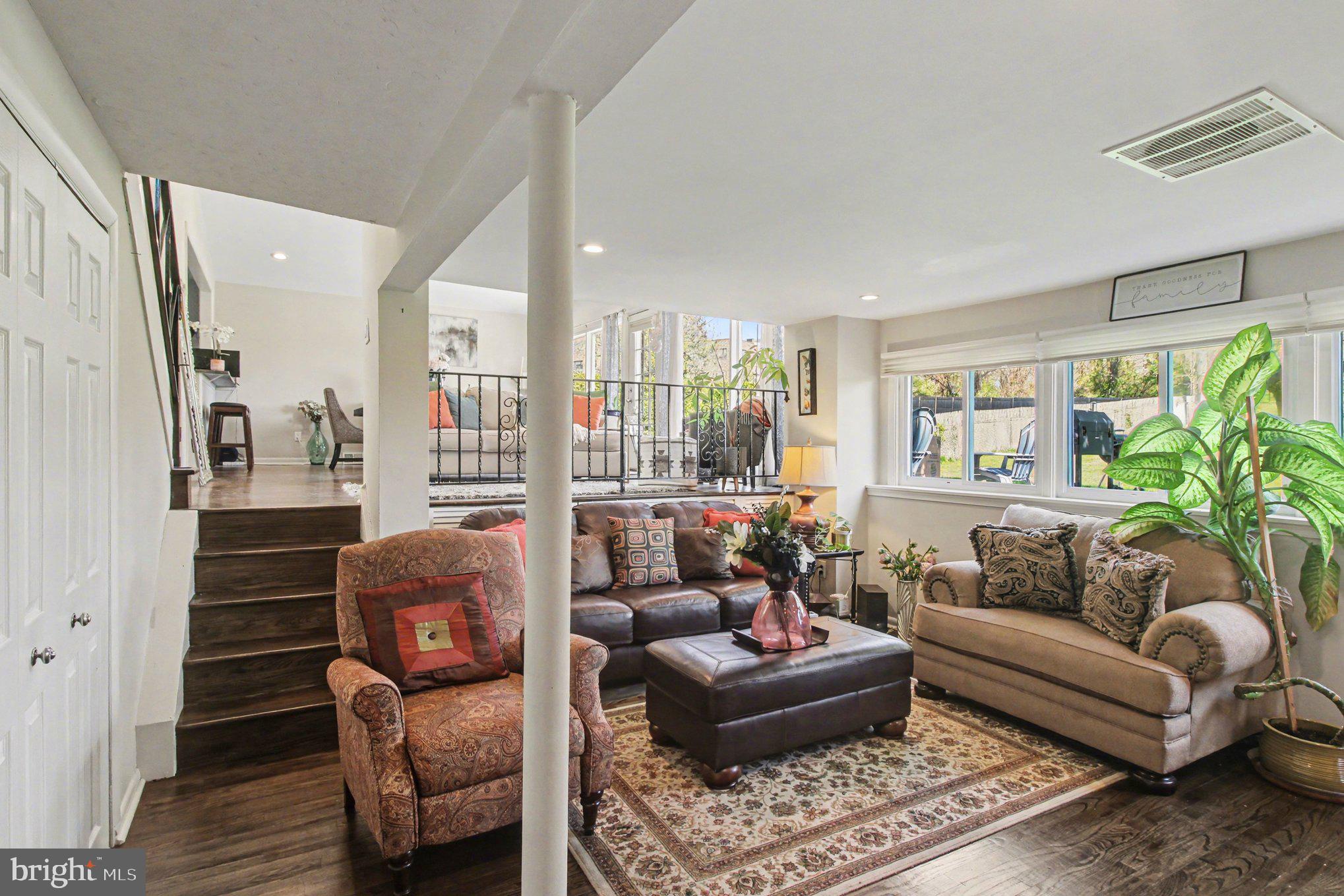 908 Fraser Road Glenside, PA 19038 - Photo 26 of 36 a living room with furniture and a large window