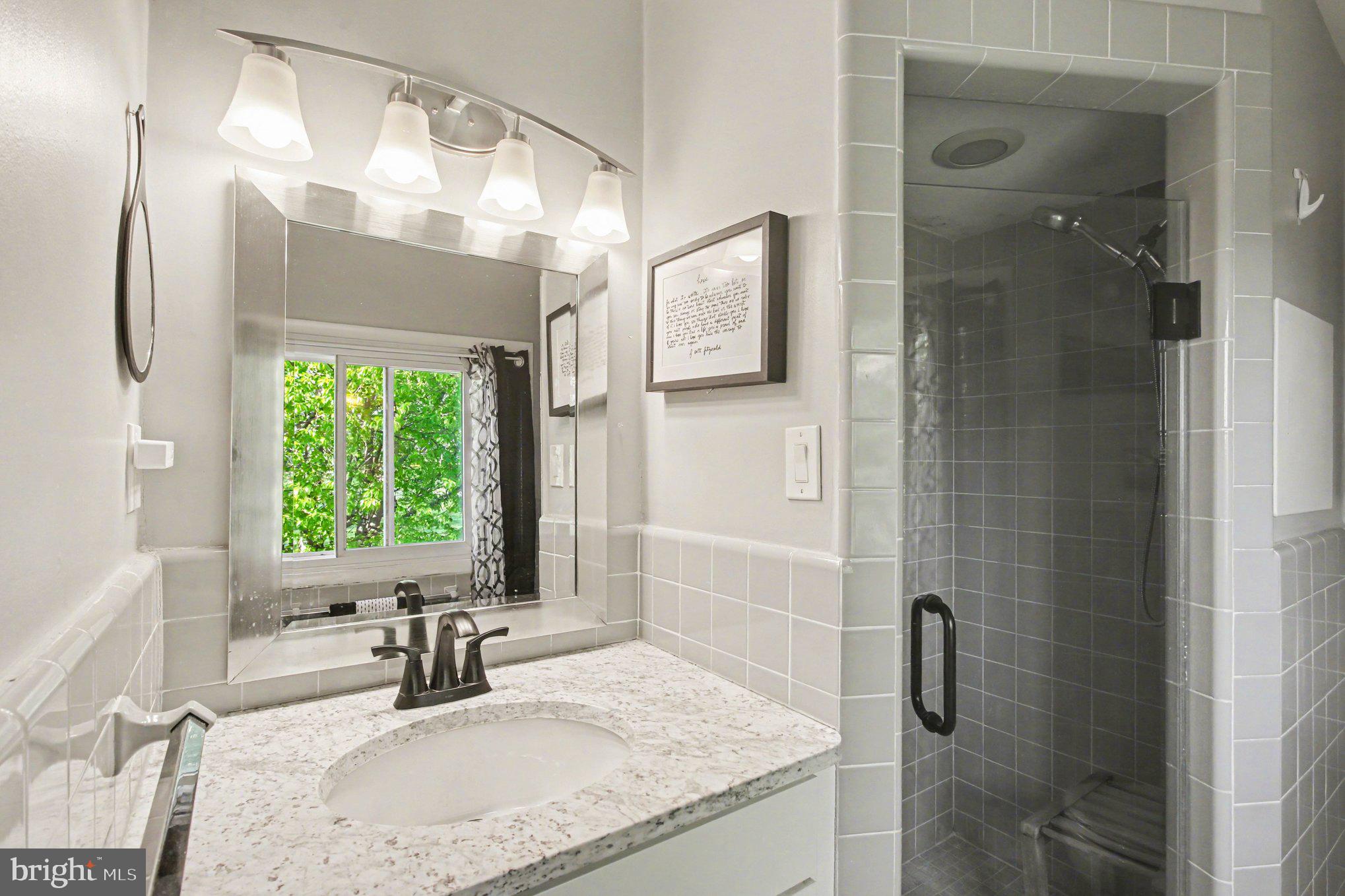908 Fraser Road Glenside, PA 19038 - Photo 28 of 36 a bathroom with a granite countertop sink a mirror and shower