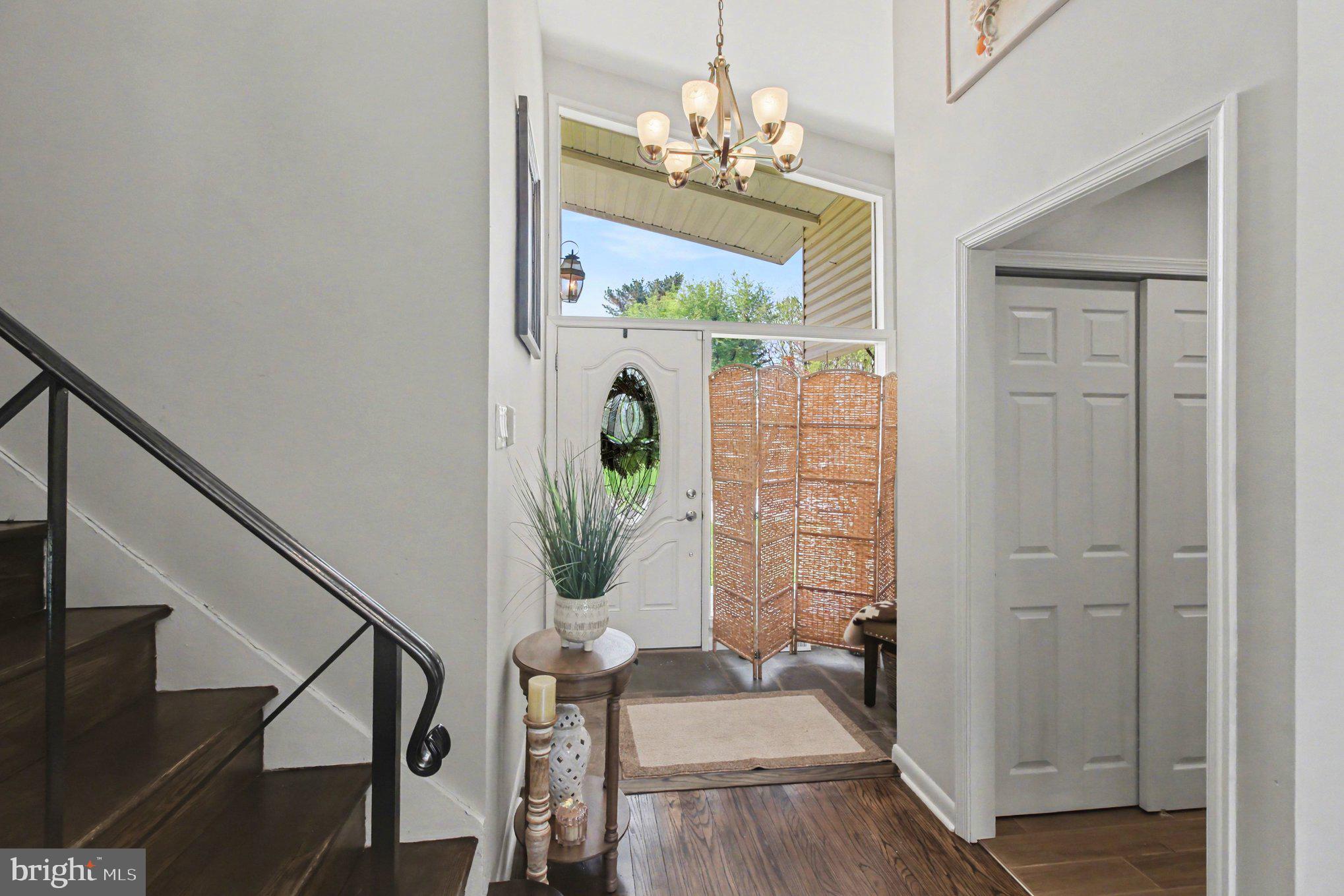 908 Fraser Road Glenside, PA 19038 - Photo 8 of 36 a view of a dining room with furniture wooden floor and a chandelier