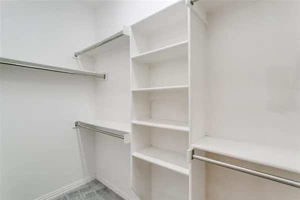 a view of an empty walk in closet