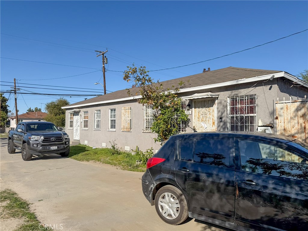 804 East Oaks Street Compton, CA 90221 - Photo 8 of 9 a car parked in front of a house