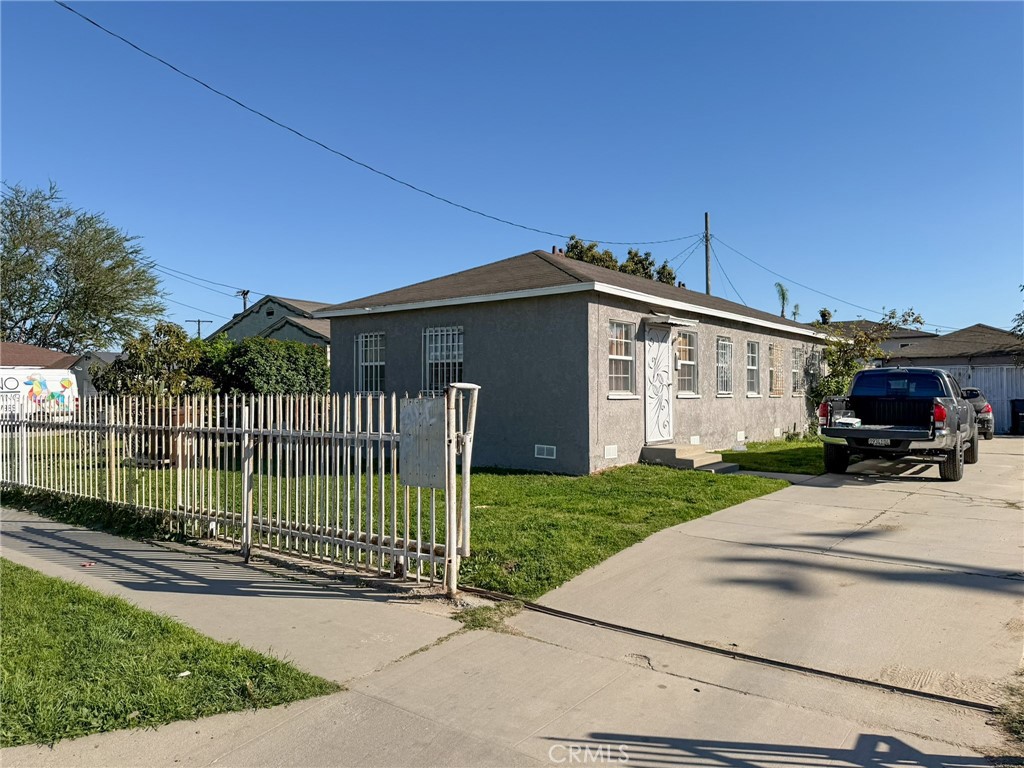 804 East Oaks Street Compton, CA 90221 - Photo 9 of 9 a front view of a house with garden