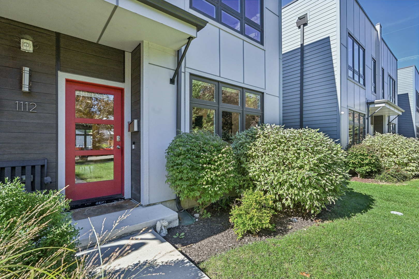 a view of a house with brick walls and a yard