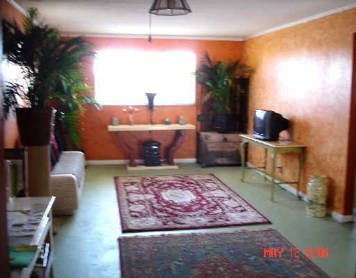 450 Southwest 2nd Avenue, Unit 208A Boca Raton, FL 33432 - Photo 8 of 10 a living room with furniture and a potted plant