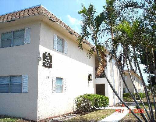 450 Southwest 2nd Avenue, Unit 208A Boca Raton, FL 33432 - Photo 10 of 10 a front view of a house with a tree