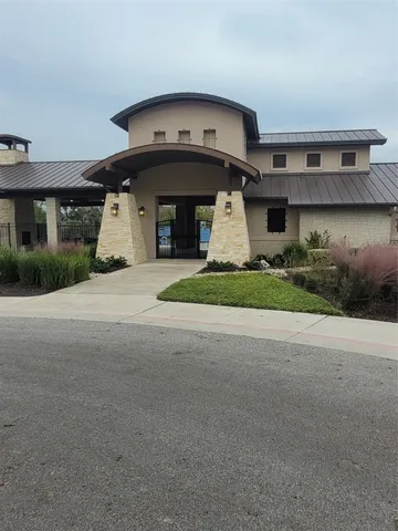 a view of a building with a street
