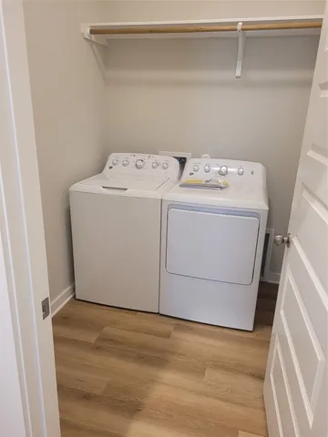 a view of kitchen with cabinets and wooden floor
