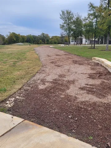 a view of a lake with a yard