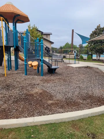 a view of a building with a yard