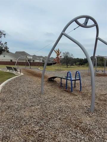 a view of swimming pool with a yard and sitting area