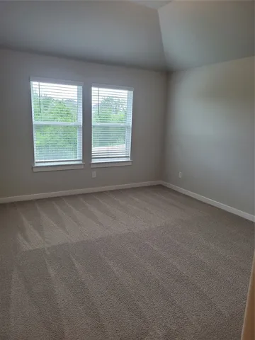 a kitchen with granite countertop a refrigerator stove and microwave