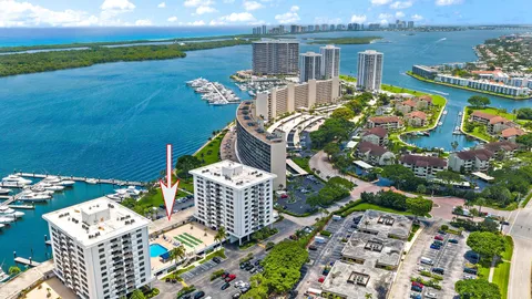 an aerial view of a house with a ocean view