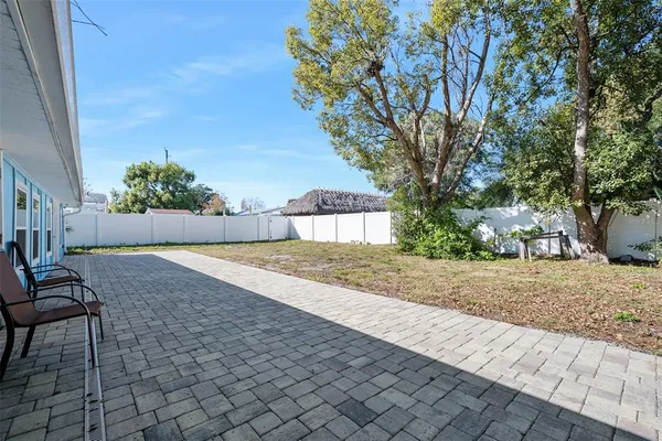 a view of a house with a backyard