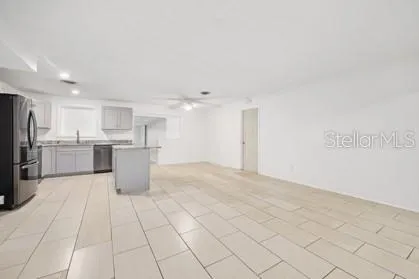 a view of kitchen with white cabinets
