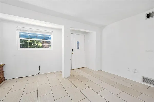 a view of an empty room with a window