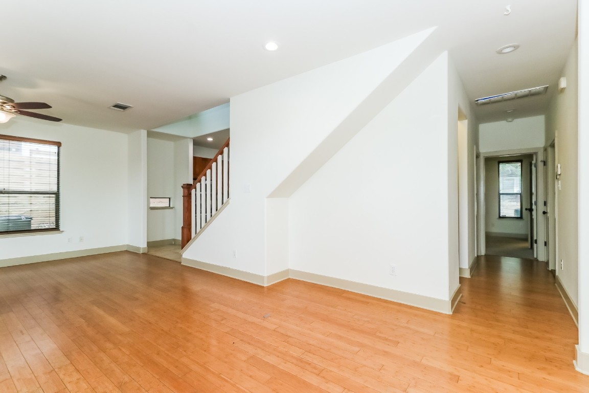 1212 Woodland Avenue, Unit A Austin, TX 78704 - Photo 2 of 20 a view of an empty room with wooden floor and a window