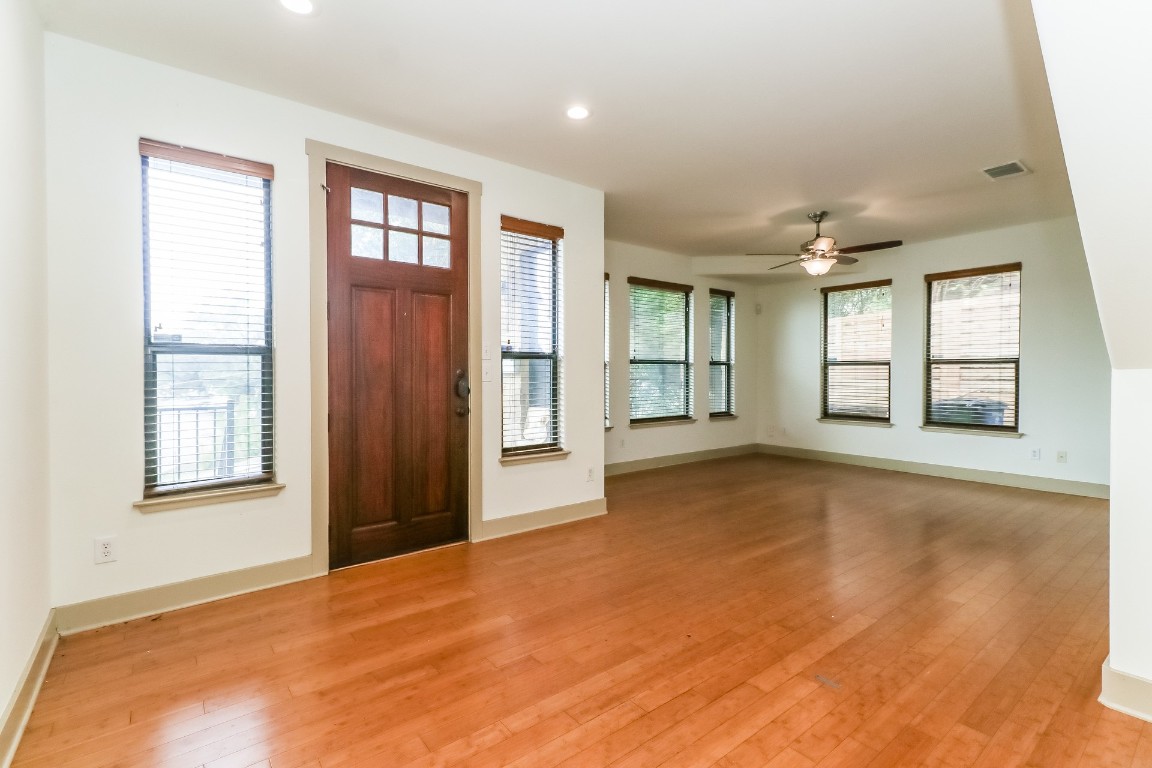 1212 Woodland Avenue, Unit A Austin, TX 78704 - Photo 3 of 20 an empty room with windows and entrance