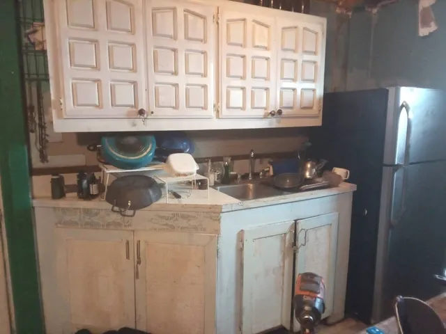 a kitchen with a sink and cabinets
