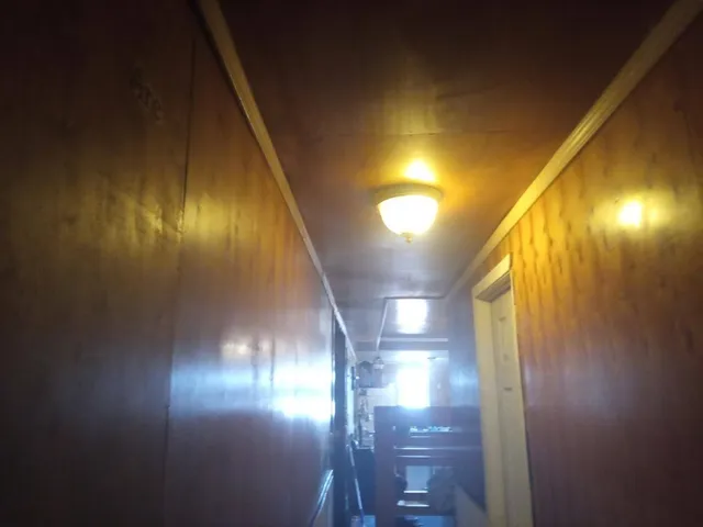 a bathroom with a sink mirror and toilet