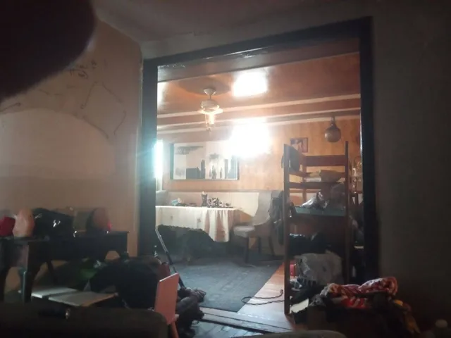 a room with wooden floor and furniture