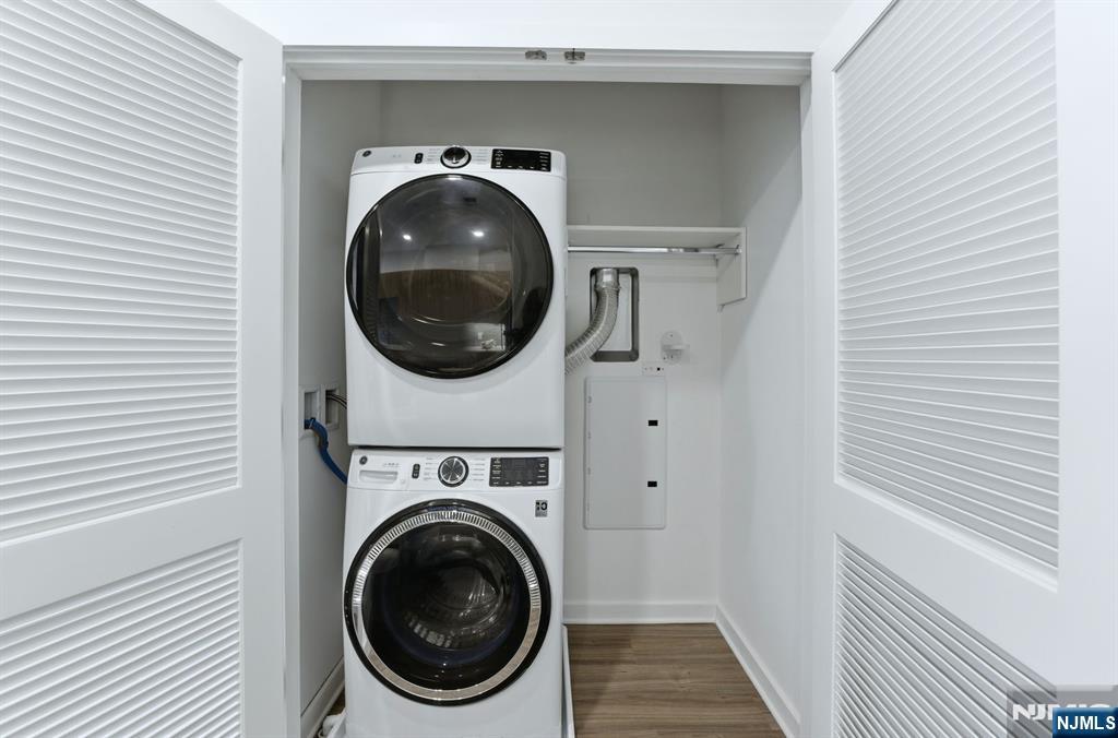 37 Orange Road, Unit 206 Montclair, NJ 07042 - Photo 11 of 16 a view of a hallway with washer and dryer