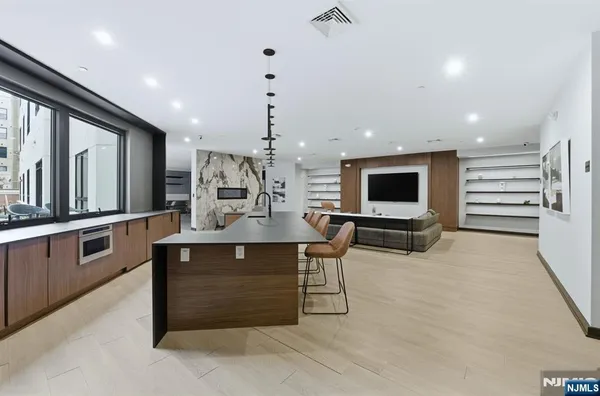 a large kitchen with a table and chairs in it