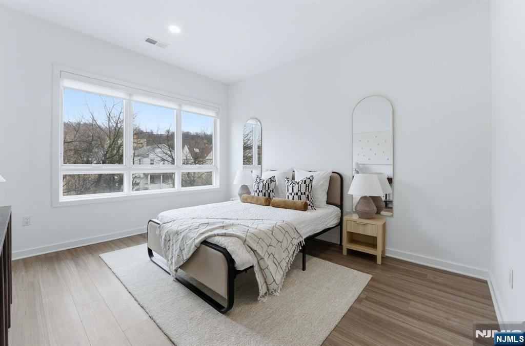 37 Orange Road, Unit 206 Montclair, NJ 07042 - Photo 6 of 16 a bedroom with bed and a window
