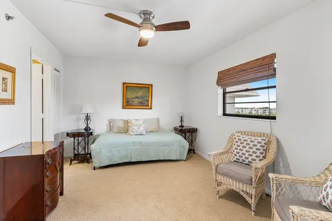 a bedroom with a bed and a chair