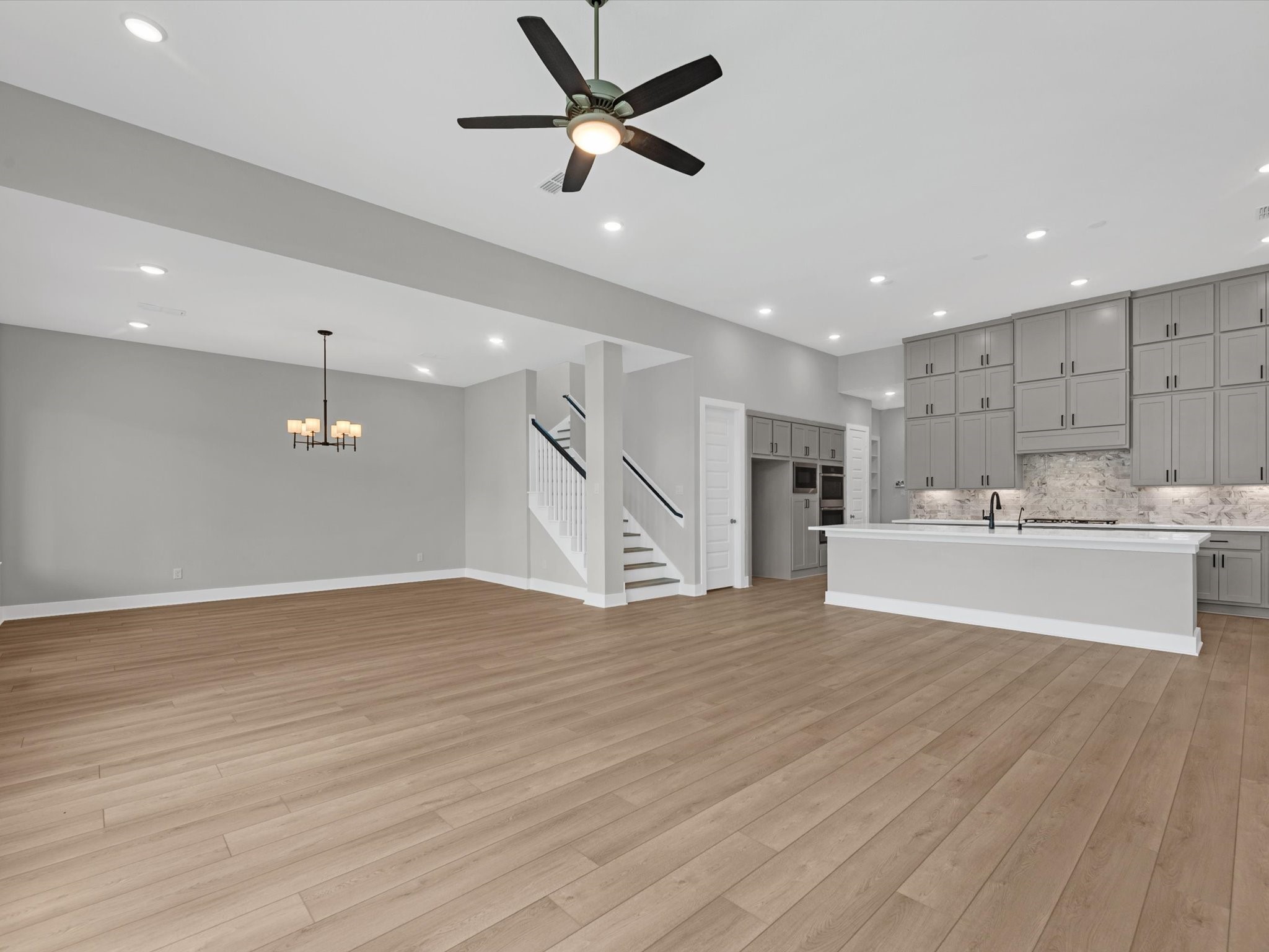 8123 Sunny Rdg Drive Fulshear, TX 77441 - Photo 6 of 42 a view of kitchen with wooden floor and window
