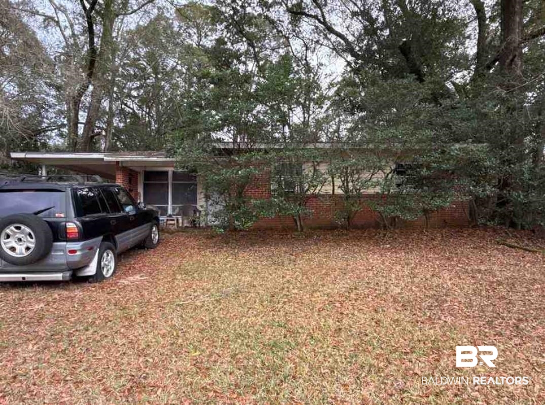 4117 Rebecca Road Mobile, AL 36609 - Photo 1 of 6 View of front of home featuring a carport and brick siding