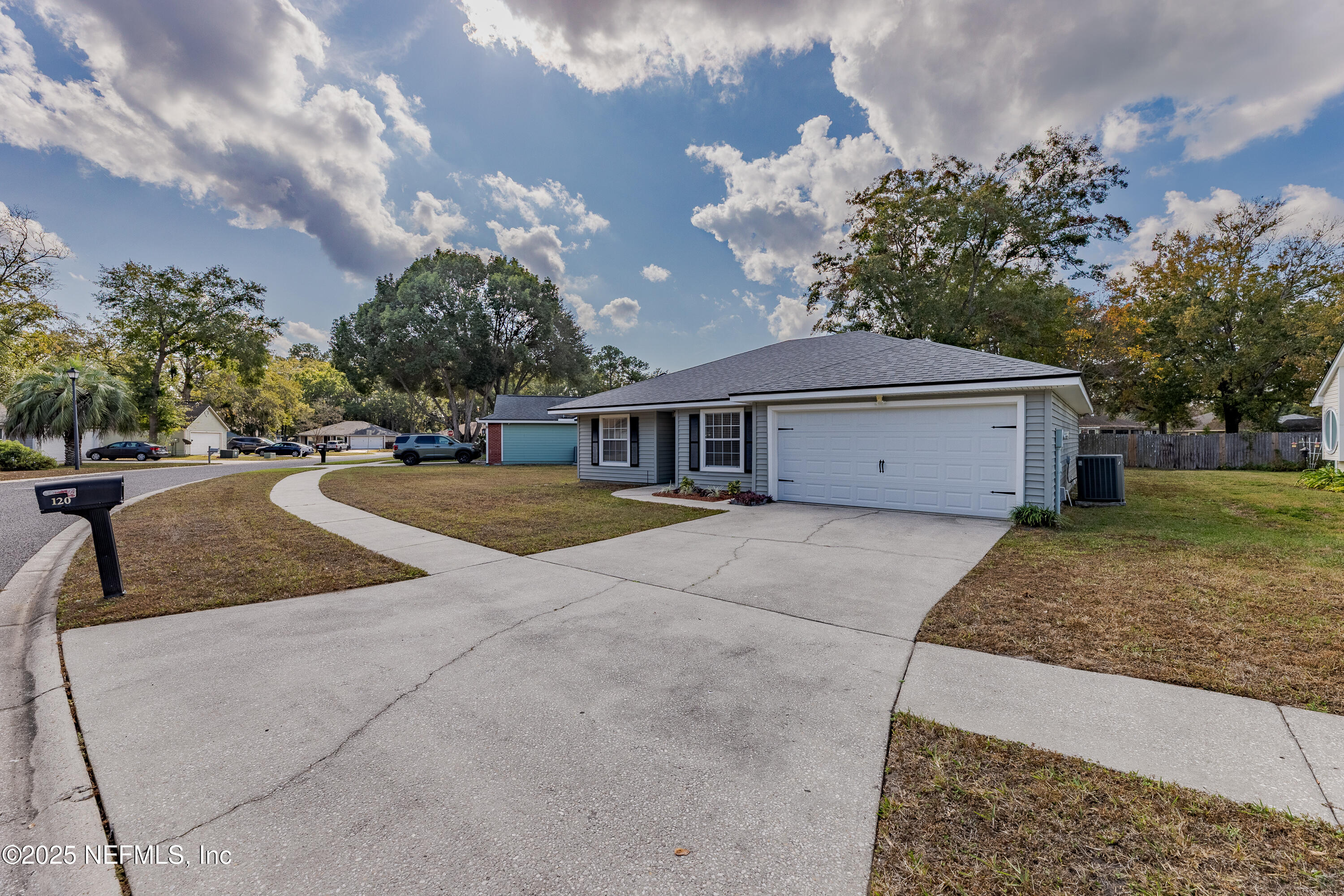 120 Clapton Way Jacksonville, FL 32220 - Photo 2 of 33 a view of a house with a yard and a garage
