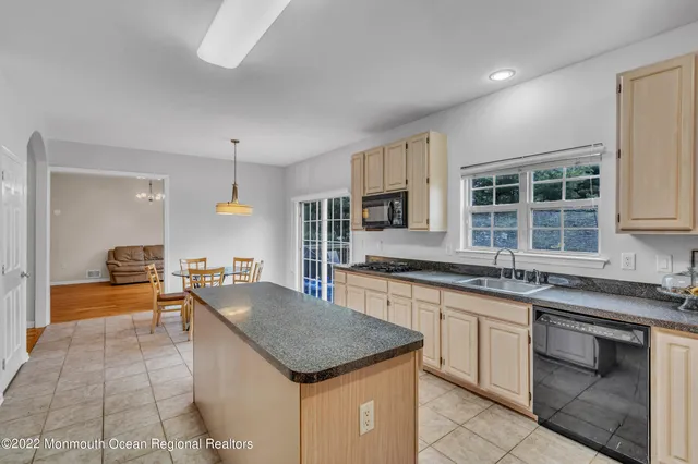 a kitchen with a table and chairs
