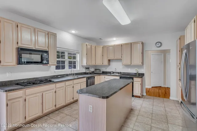 a kitchen sink sitting next to a window