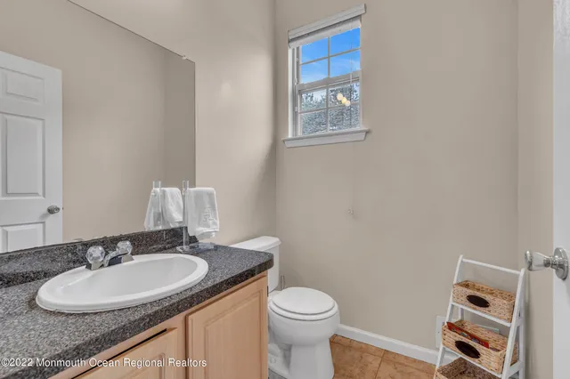 a spacious bedroom with a bed and a window