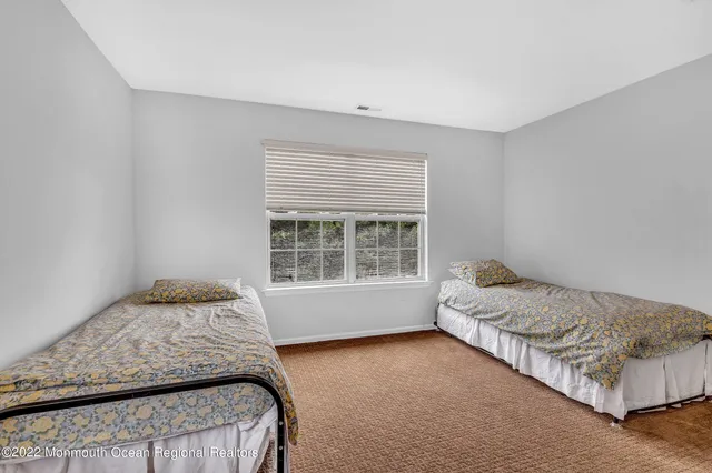a living room with furniture dining area and a chandelier