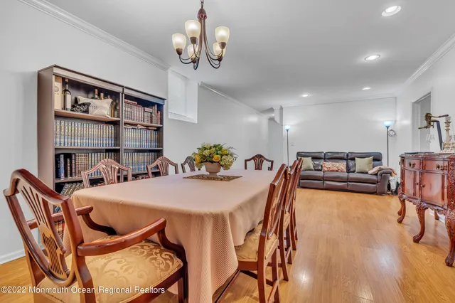 a bedroom with bed and wooden floor